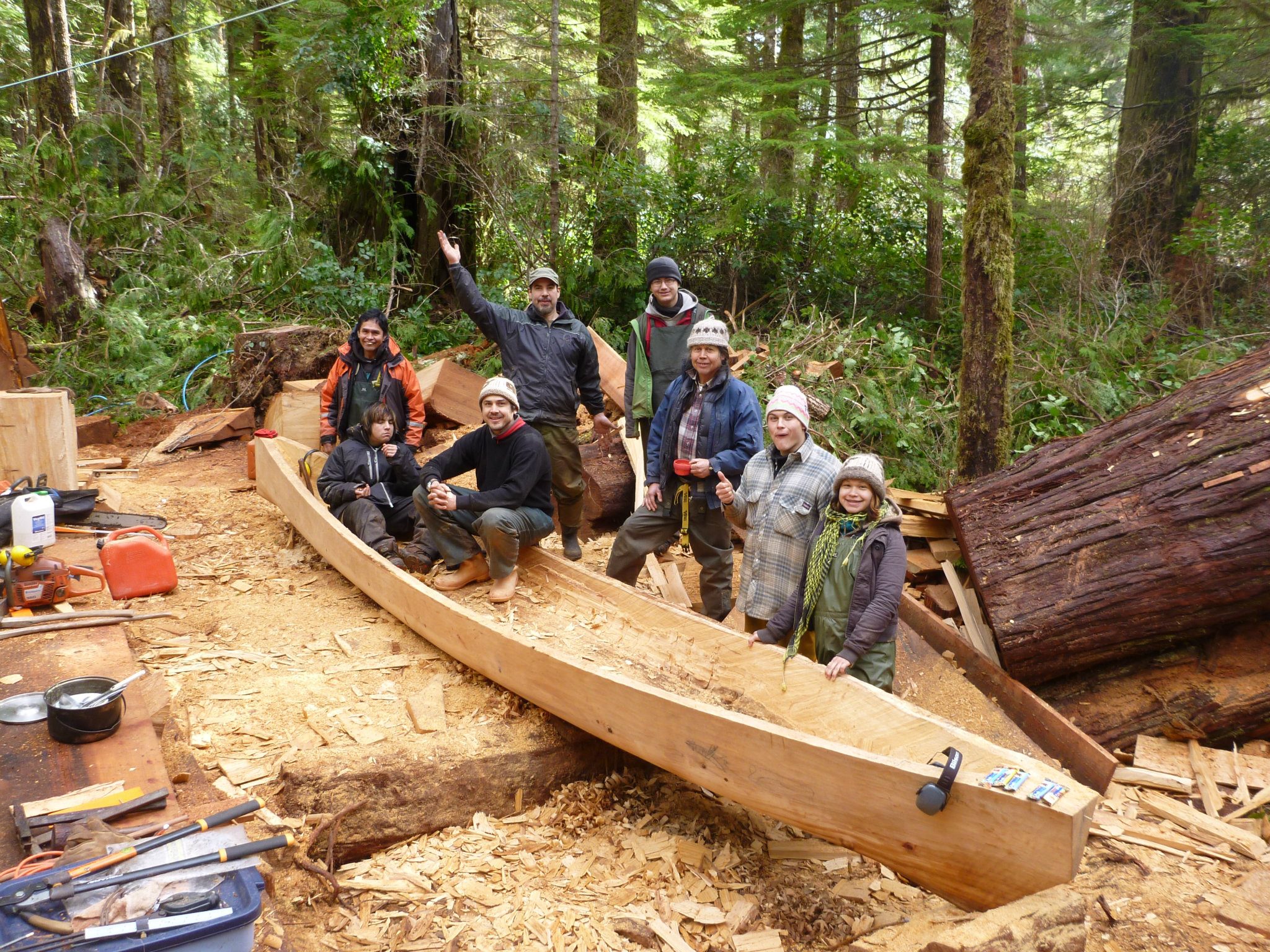 Photo: Joe Martin and assistants carving canoe ( Layla Čuucqa Rorick).