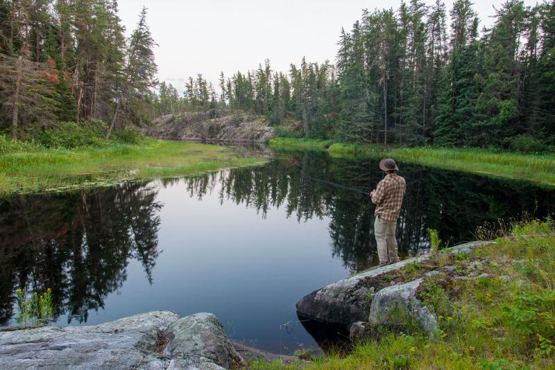 Fishing on Black River, in caribou winter habitat