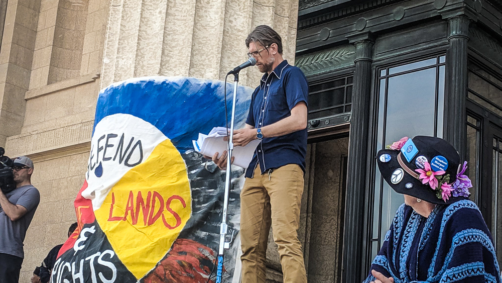 Eric Reder, Wilderness and Water Campaigner shows us his copy of the 400 page environmental assessment. CPS is claiming that only hot, dry and windy days will cause air quality concerns.