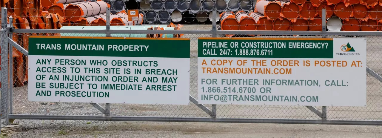 Pieces of the Trans Mountain oil pipeline project sit in a storage lot outside of Hope, British Columbia, Canada, on June 6, 2021. (Photo by Cole Burston/AFP via Getty Images)