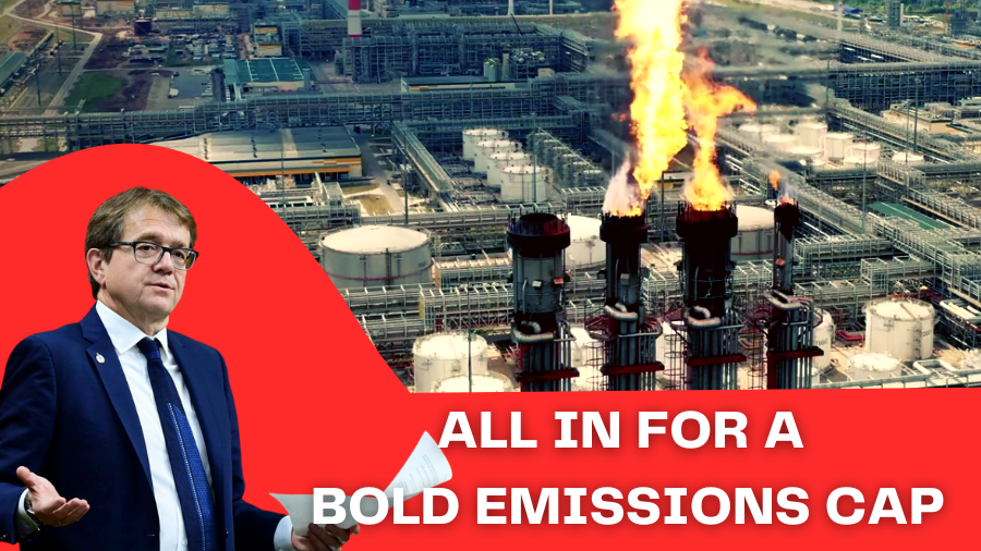 A photo of Nathan Wilkinson shrugging while a fossil fuel plant is unleashing fire. The text says "All in for a bold emissions cap". End of image description. 