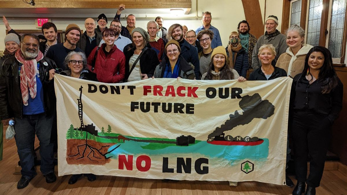 Image of community activists holding a banner that reads: Don't Frack our Future!