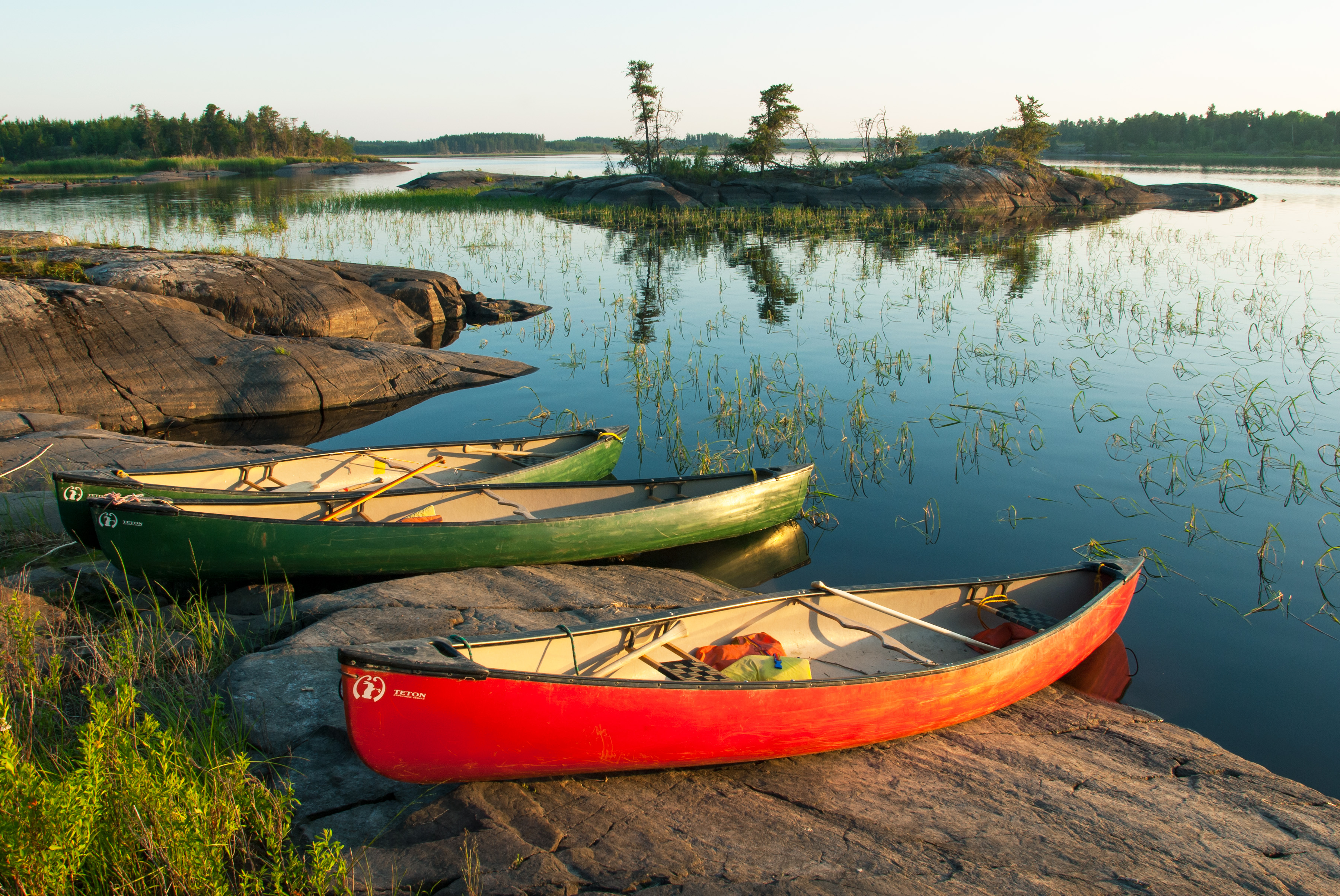 Canoes on the shore of Rice River in Hollow Water First Nation territory.