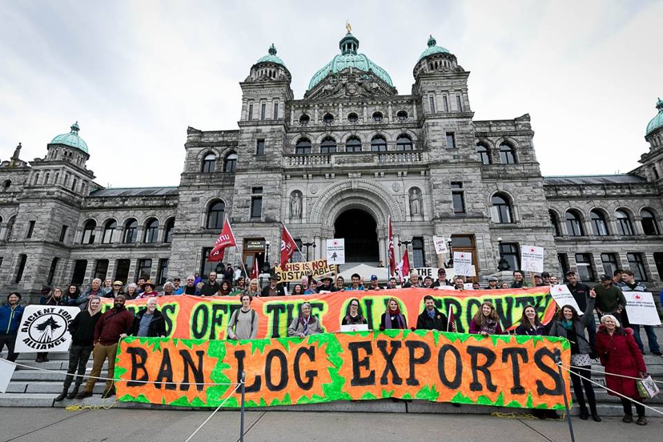 Protest in front of BC legislature holding sustainable forestry banner