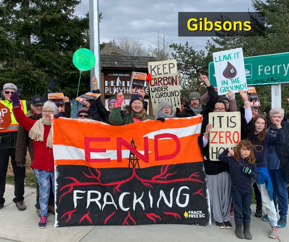 Protesters in Gibsons, B.C. holding and End Fracking banner.