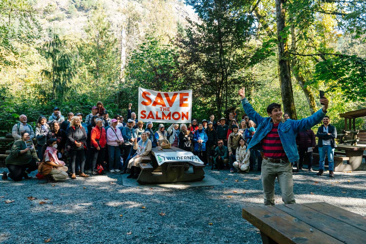 An enthusiastic group of people gathered in the forest to save Goldstream/SELEKTEL