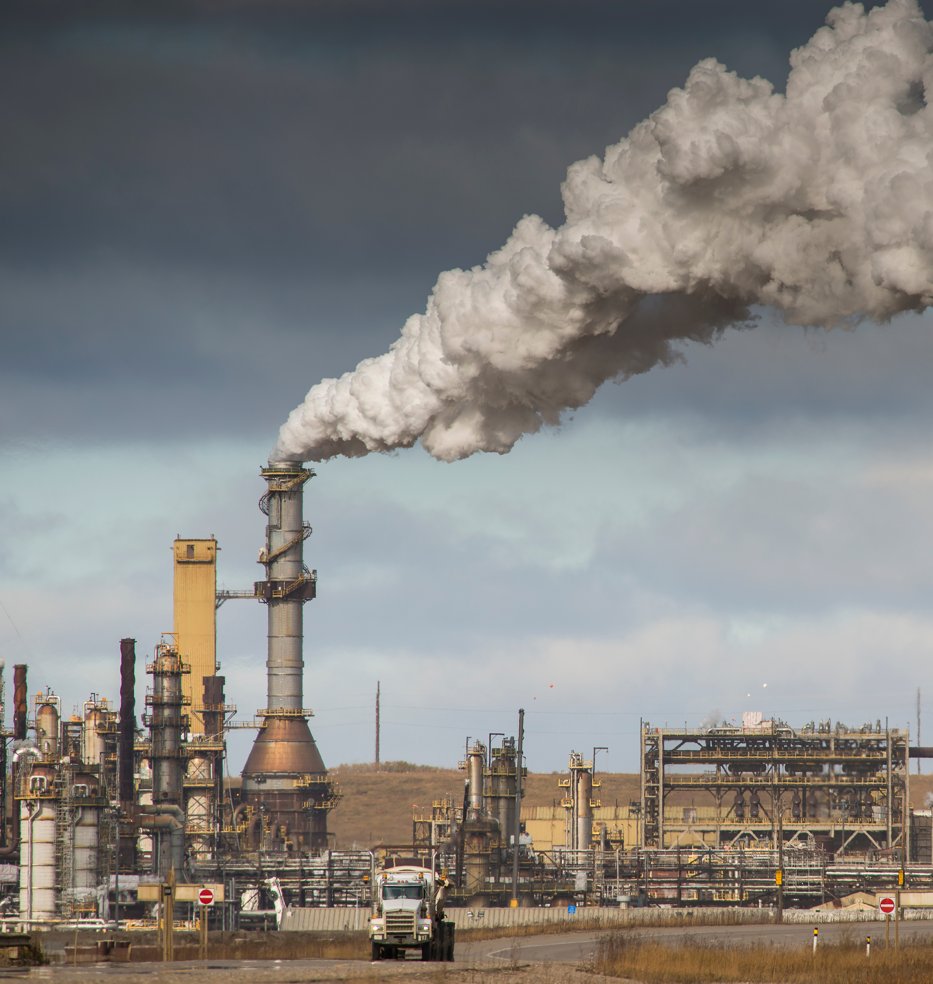 Syncrude upgrader and trucks, Highway 63, A.B. (Garth Lenz).