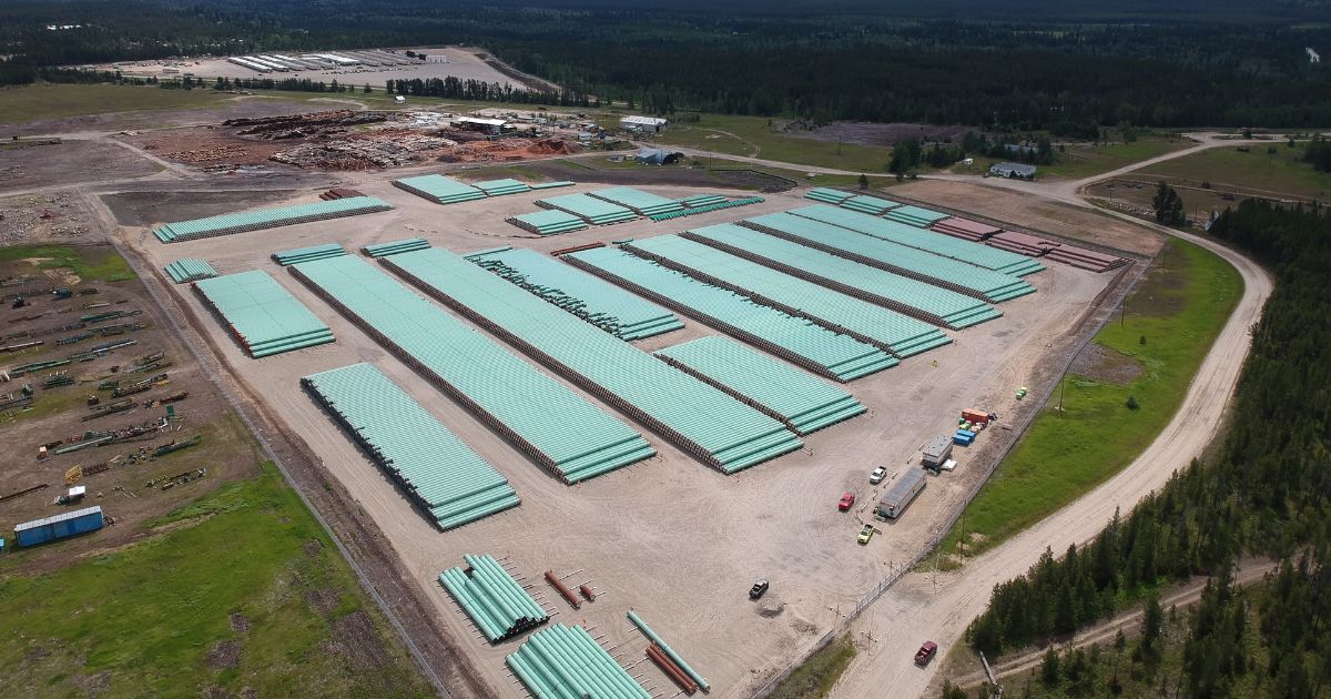 An aerial photo of trans mountain construction materials. End of image description. 