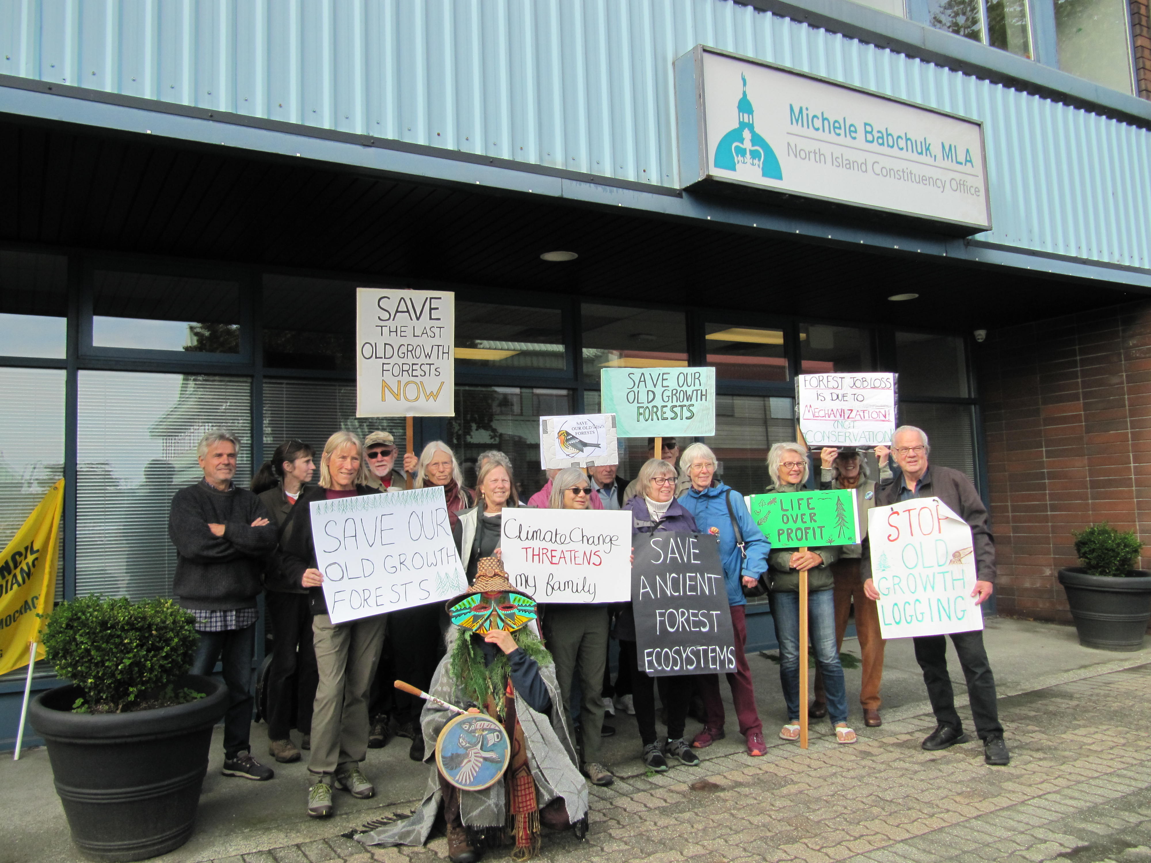 A group of people posing in front of MLA Michele Babchuk's office. End of image description.