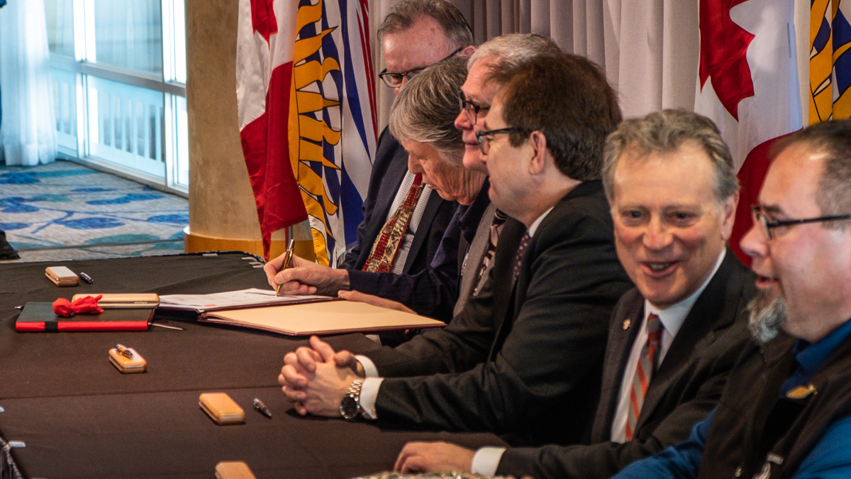 Signing taking place at the caribou agreement ceremonial signing and press conference on February 21, 2020