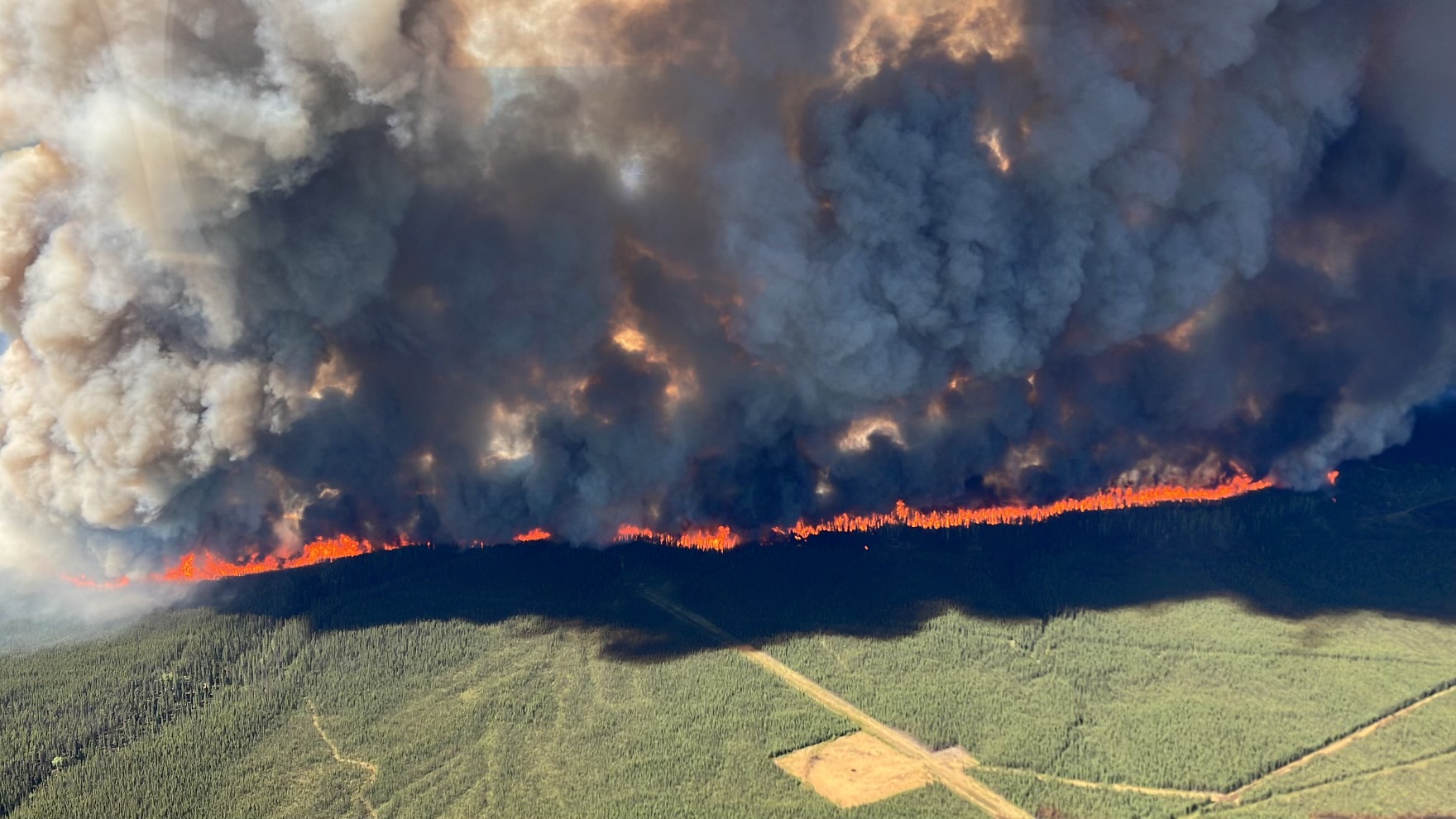 Aerial view of a wildfire. End of image description.