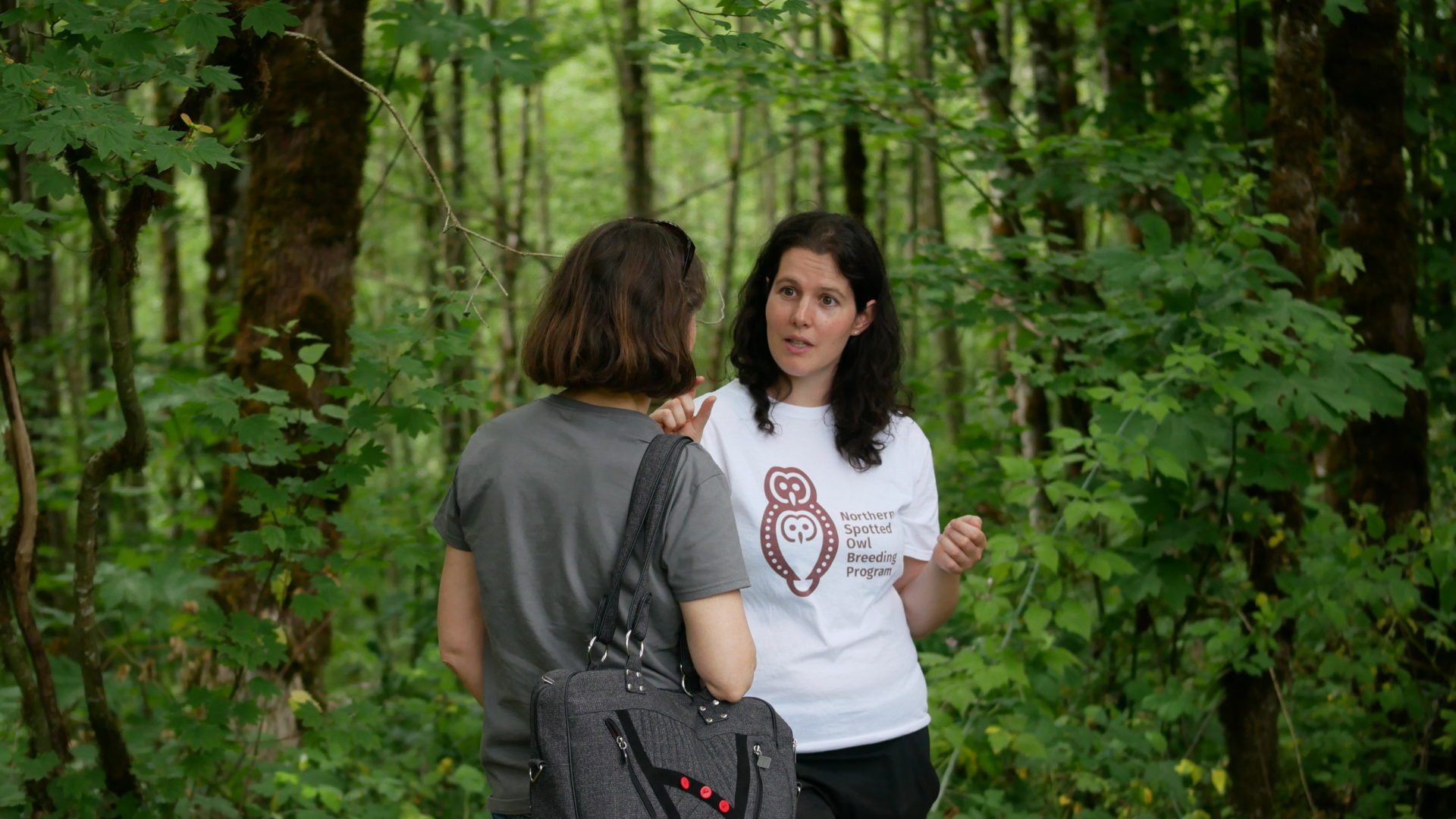 Journalist Sarah Cox interviews McCulligh outside an aviary at the spotted owl breeding facility. Photo: Carol Linnitt / The Narwhal