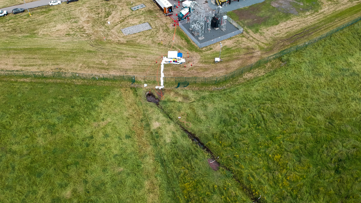 The Wilderness Committee released an aerial photograph that appears to show oil seeping onto a field. Photo: Wilderness Committee