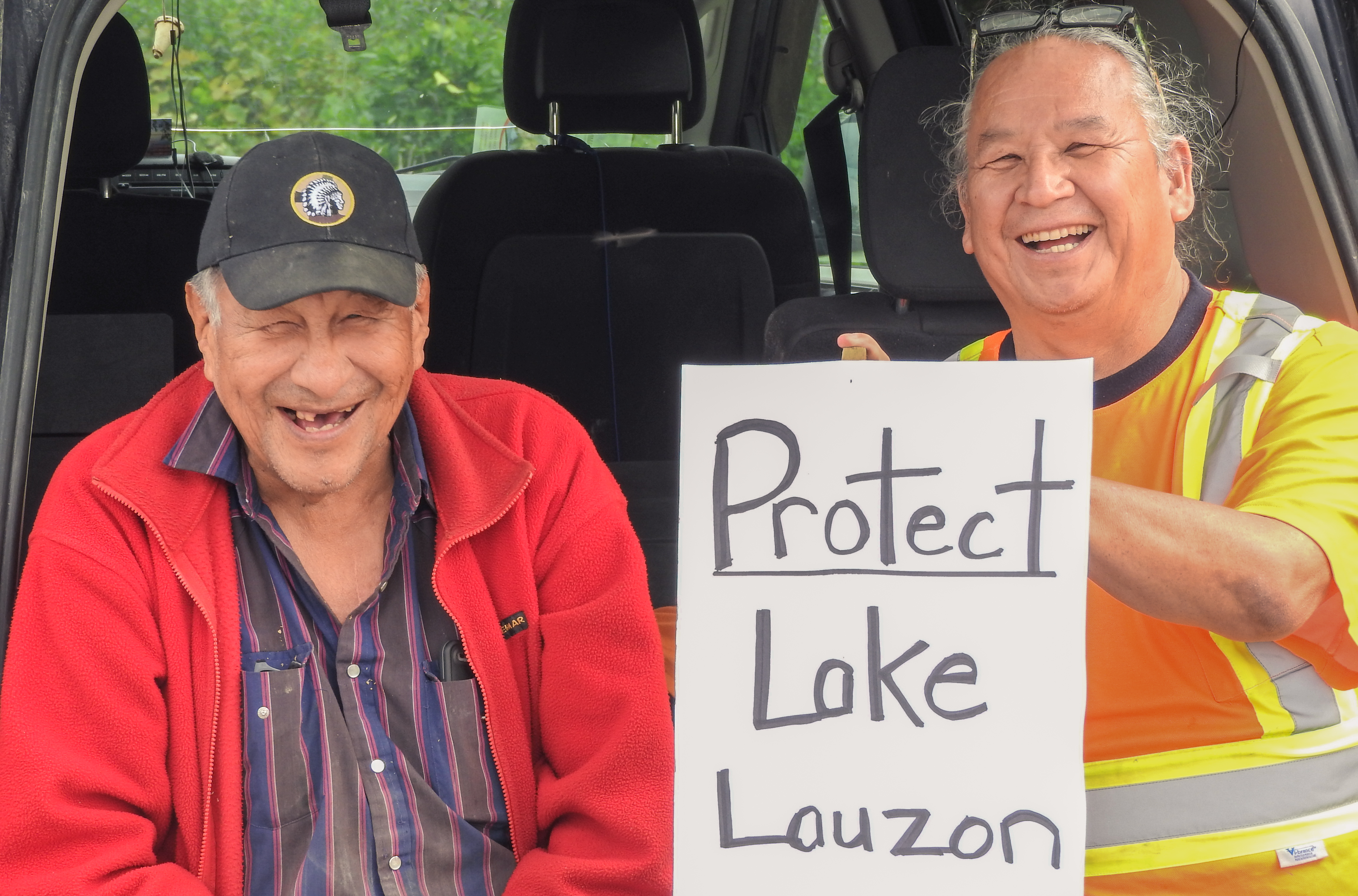 Ray Owl of the Sagamok Anishnabek (left) and Steve Meawasige of Serpent River First Nation share a story as they joined area residents to protest the rezoning of a parcel of Crown Land to allow for a quarry in the township of the North Shore.