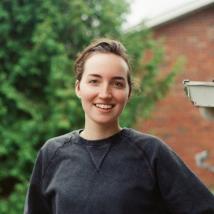 Laura posing in front of the camera. End of image description.