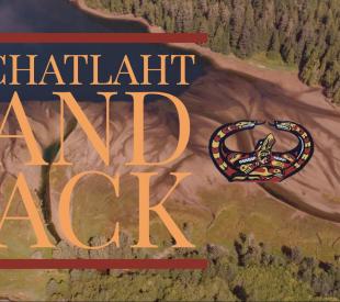 Aerial view of an estuary on Nootka Island with the phrase "NUCHATLAHT LAND BACK" overtop.