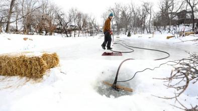 RUTH BONNEVILLE / WINNIPEG FREE PRESS  Reder draws water from the Seine River to flood the homemade rink
