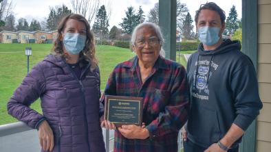 Pacheedaht First Nation Elder Bill Jones receives the 2021 Eugene Rogers Environmental Award from Wilderness Committee Vancouver Island Campaign Organizer Emily Hoffpauir and National Campaign Director Torrance Coste. Photo: Wilderness Committee