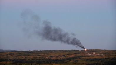 Gas flaring in northeastern B.C. blankets the sky with black smoke.