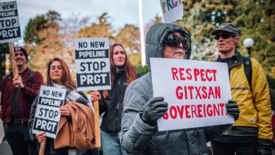 Gitxsan land defenders and supporters protest outside the B.C. legislature swearing in ceremony