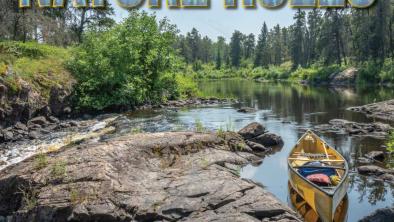A yellow canoe anchored on Rice River, Hollow Water First Nation Territory