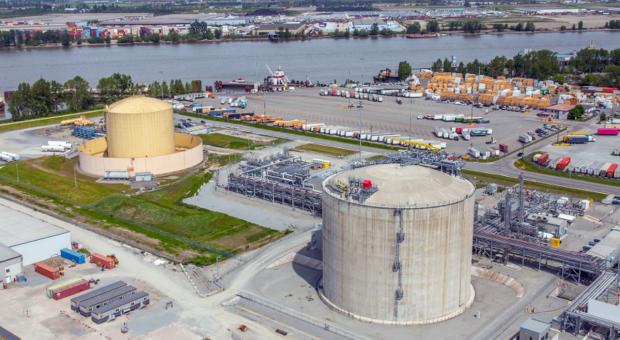 Aerial view of the existing Tilbury LNG facility with storage tanks and Fraser River in the background.