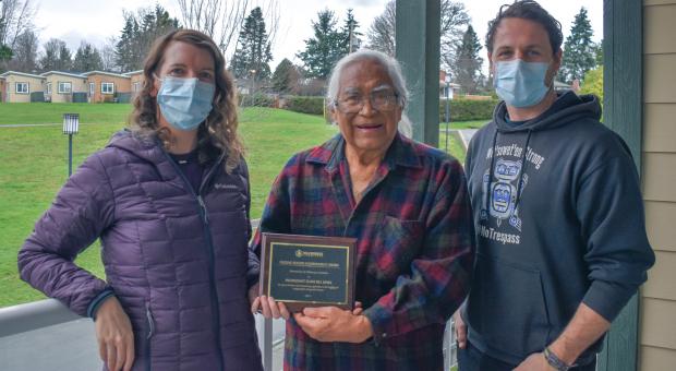 Pacheedaht First Nation Elder Bill Jones receives the 2021 Eugene Rogers Environmental Award from Wilderness Committee Vancouver Island Campaign Organizer Emily Hoffpauir and National Campaign Director Torrance Coste. Photo: Wilderness Committee