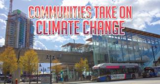 A bus at a skytrain station. There is construction on a skyscraper in the background. Text over the image says "Communities take on Climate Change." End of image description.