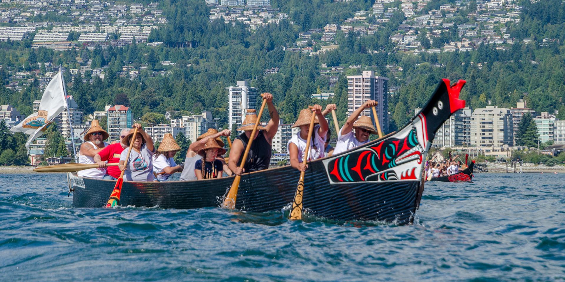 A group from Salish First Nations paddling on the Salish Sea at the Gathering of Canoes to Protect the Salish Sea event in 2012. 