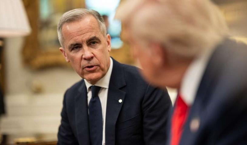 Prime Minister Mark Carney and President Donald Trump speaking at the White House. End of image description.
