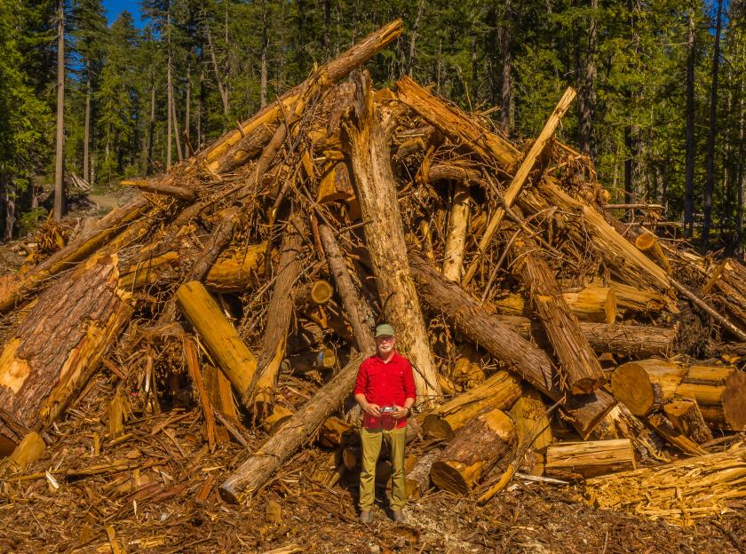 Joe Foy and logged Spotted Owl Critical Habitat. end of image description.